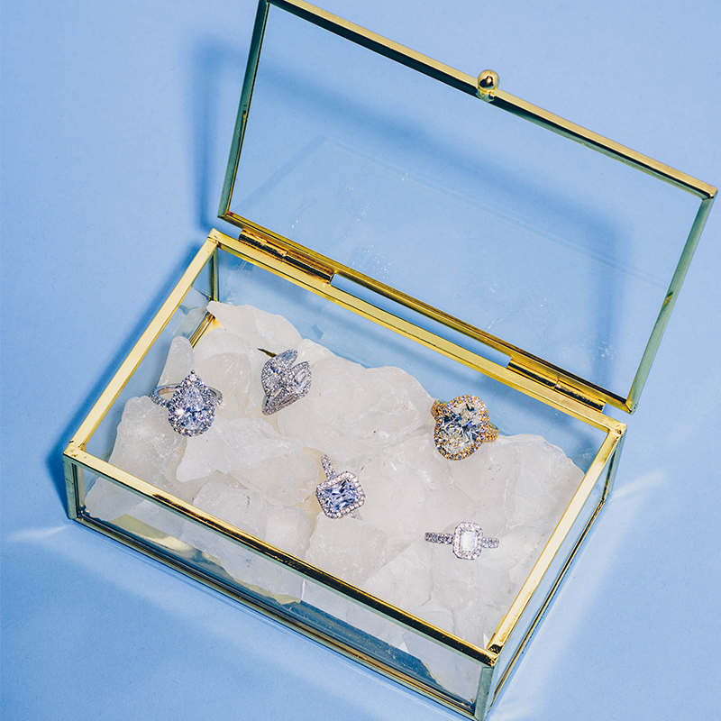 Assorted engagement rings in a gold plated box